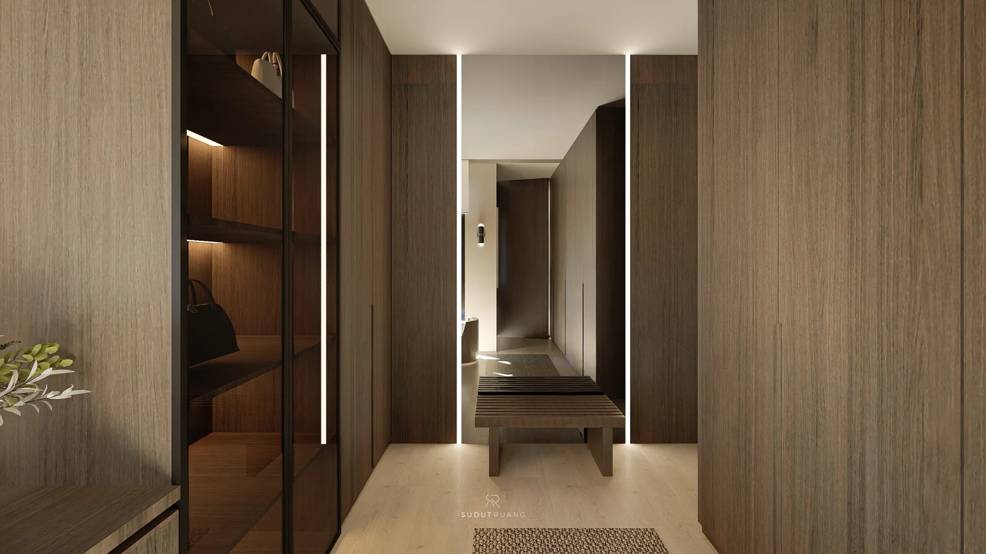 A corridor of floor-to-ceiling walnut wardrobes opens onto a glass-fronted display cabinet for handbags, leading toward a slatted bench and the bedroom beyond.