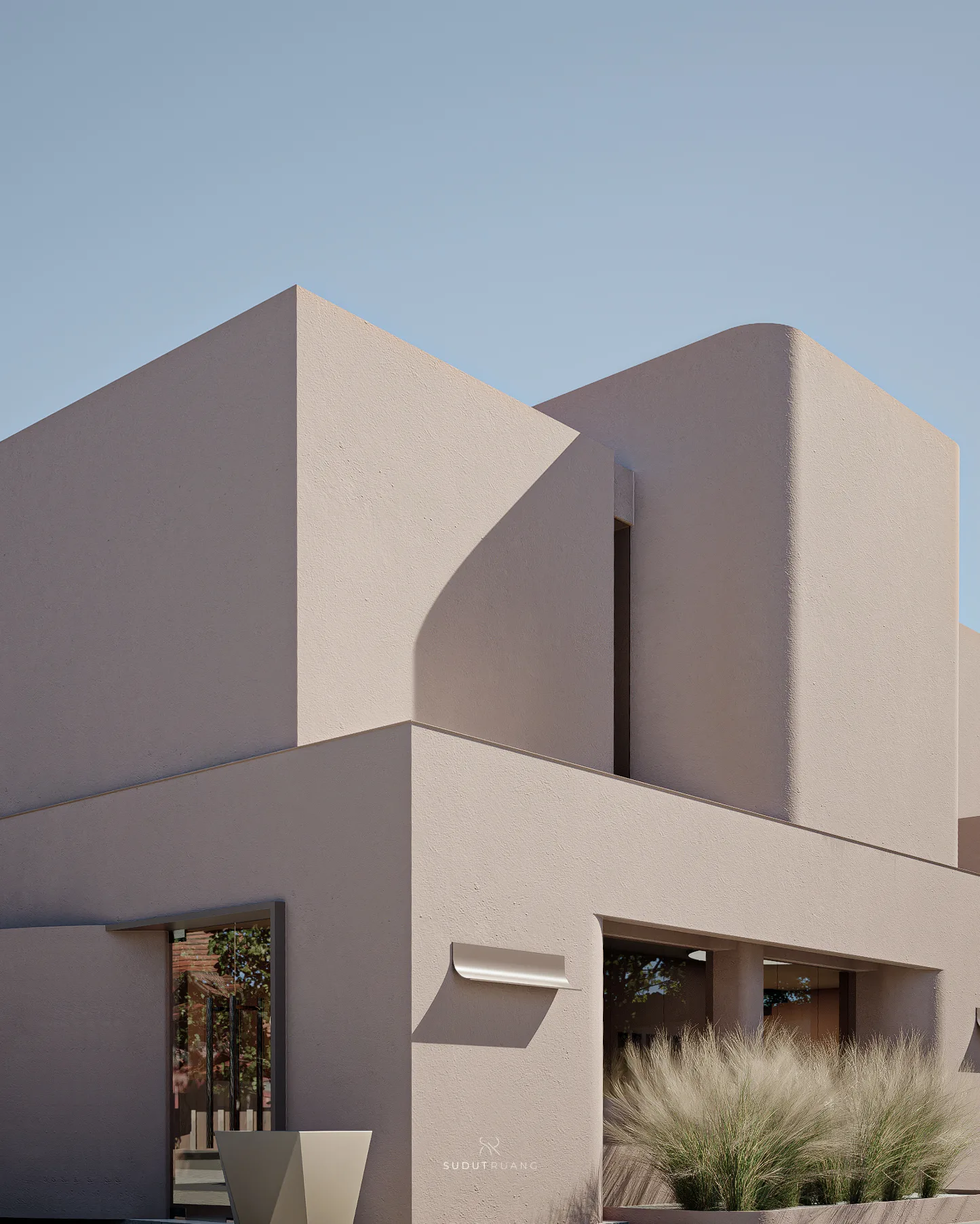 A close view of Beauty Center's roofline where the curved volume meets the square massing, plaster texture catching the daylight.