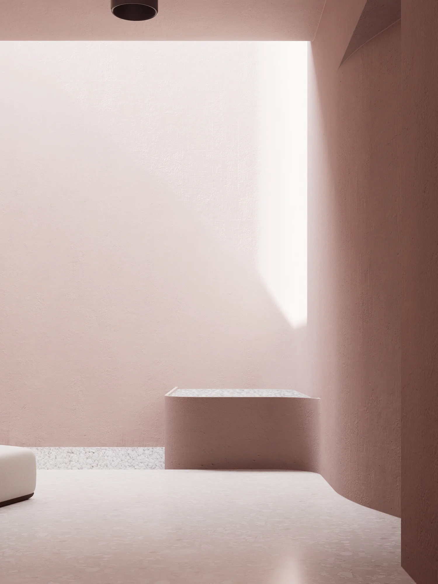 Beauty Center's built-in bench with a terrazzo-look top, set under a deep reveal that pulls daylight down the pink plaster behind it.