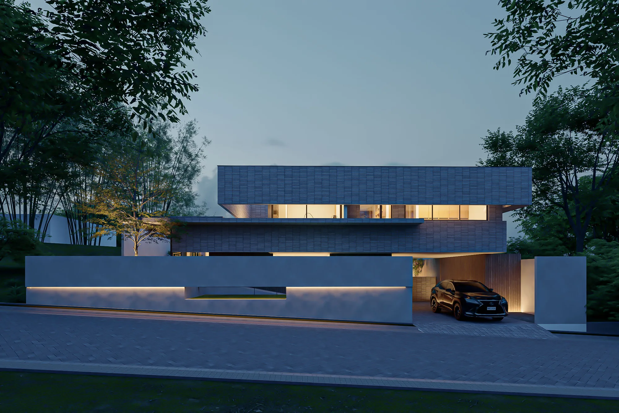 Dusk view of the two-story brick-tile facade, its lit interior glowing behind full-height glazing above a low perimeter wall with a recessed light strip.