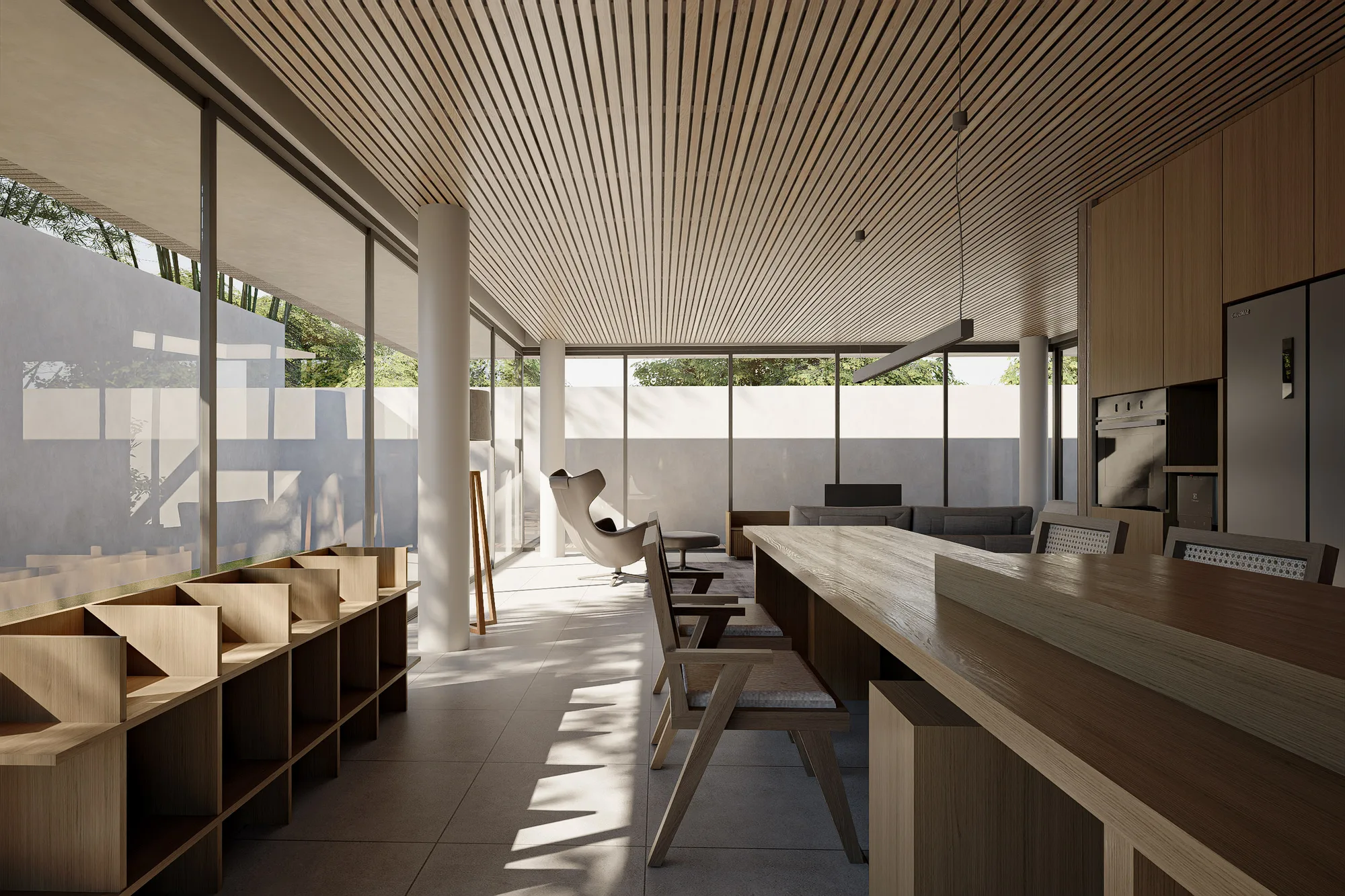 Cane-backed dining chairs surround a long oak table beneath a slatted timber ceiling, with the stainless refrigerator and open shelving behind.