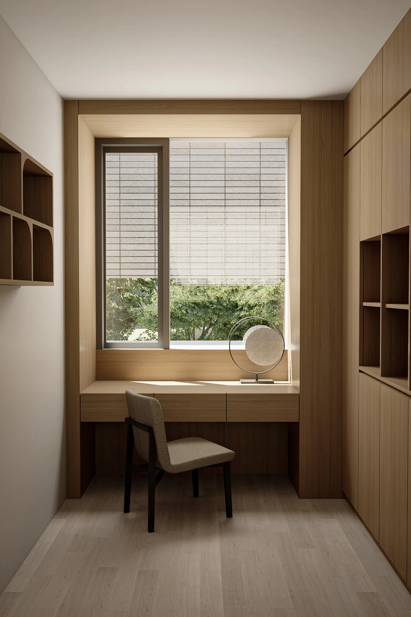 A window seat doubles as a desk, its built-in shelving and a circular mirrored object catching the light beside a woven shade.