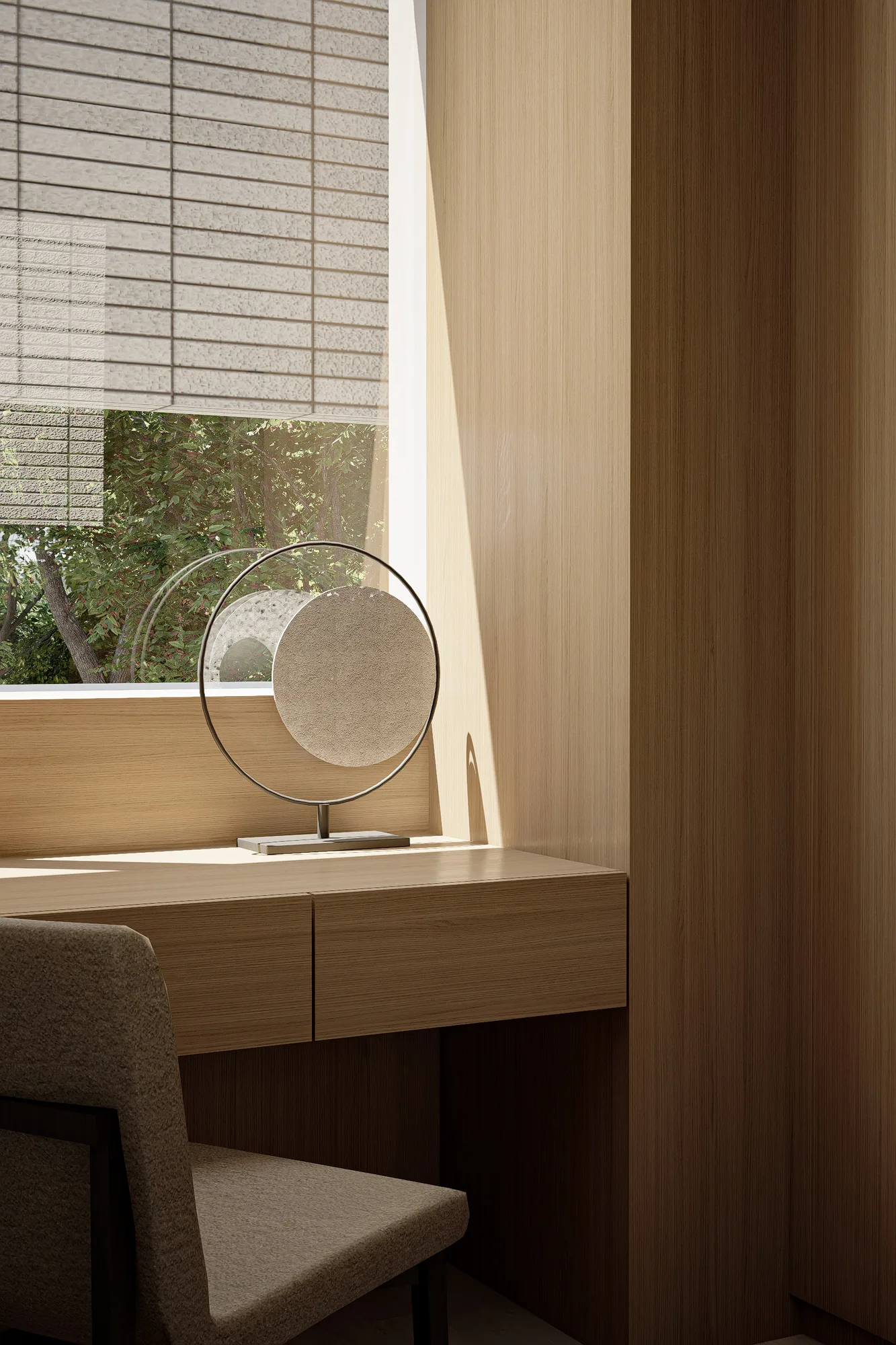 Close on the built-in desk, a circular mirrored decor object sits in the sunlight cast through the woven blind.