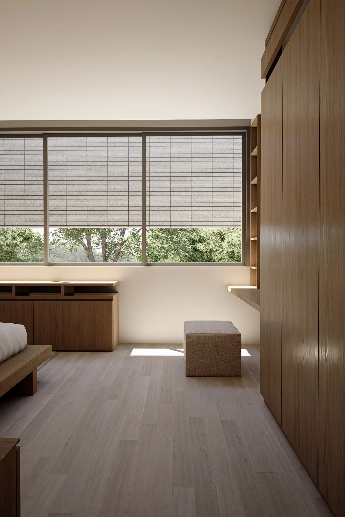 A bedroom corner where a woven roller shade filters daylight beside a built-in desk and full-height timber wardrobe.