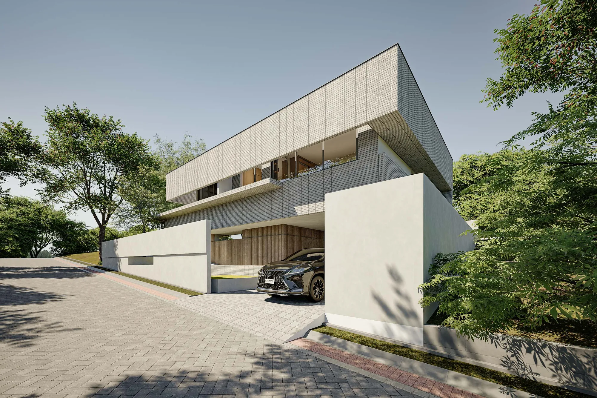 An uplit tree stands beside the timber deck at dusk, the glowing kitchen and living room visible through open glazing.