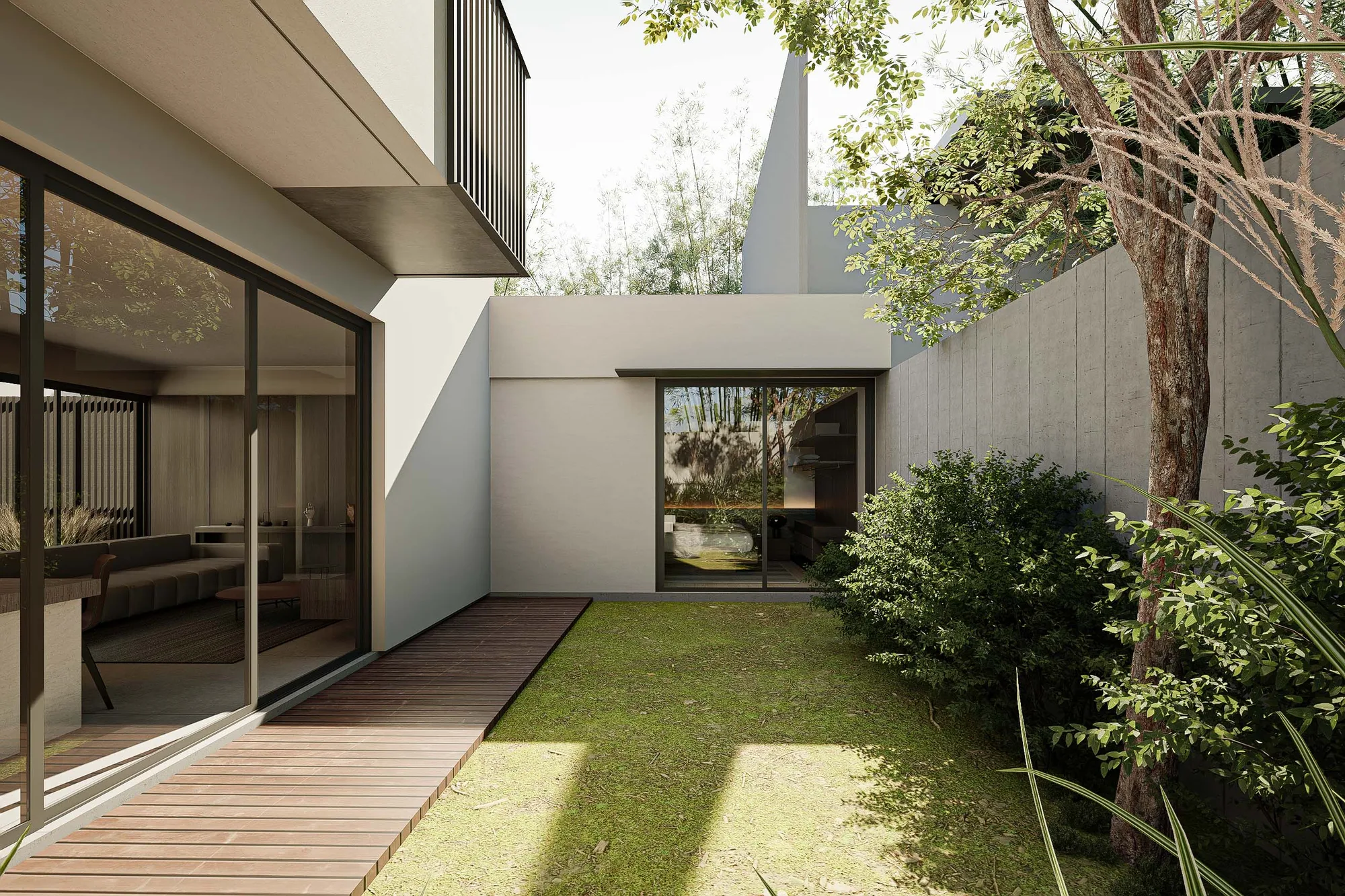 Ground-floor living space opening through full-height glass onto a grass-planted side garden enclosed by a concrete-block wall.