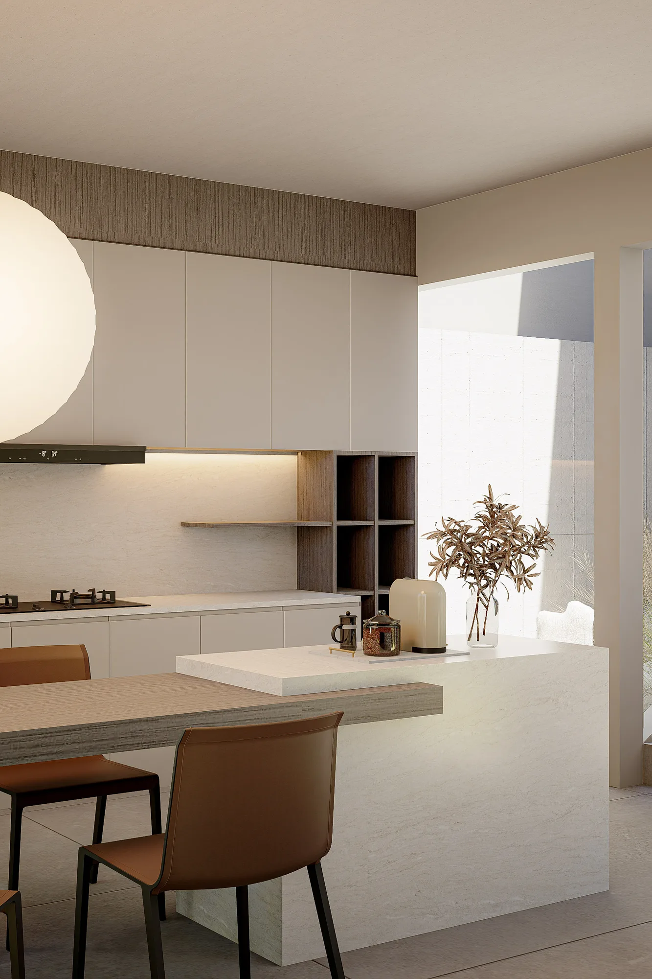 Kitchen island and open shelving in cream cabinetry, courtyard light falling across the dining table beyond.