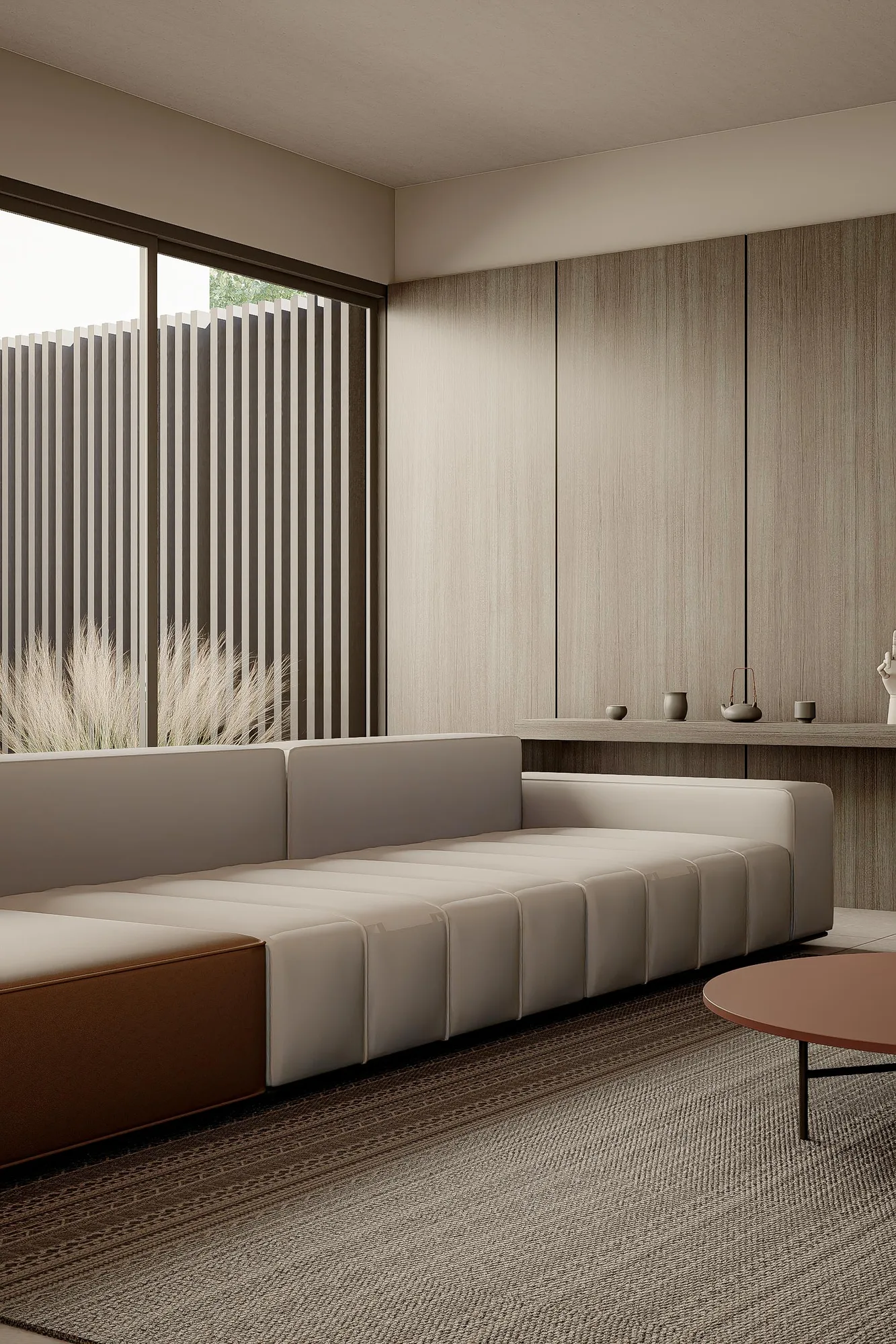 Living room sofa against a walnut-panelled wall, full-height glass opening onto the timber-screened side garden.