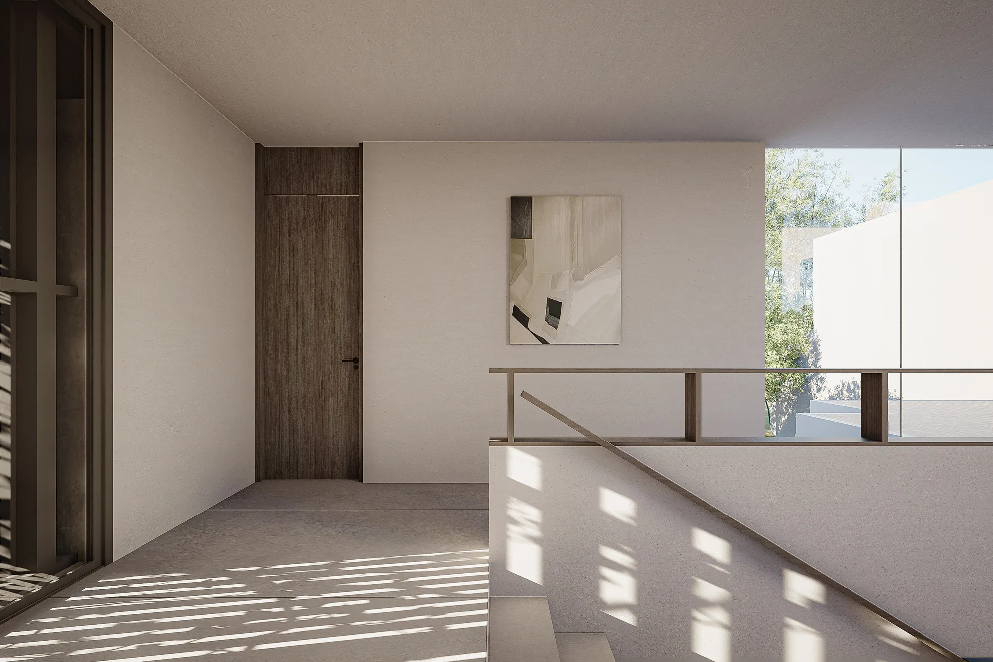 Upstairs hallway landing with a framed artwork on pale plaster, staircase descending toward the ground-floor courtyard.