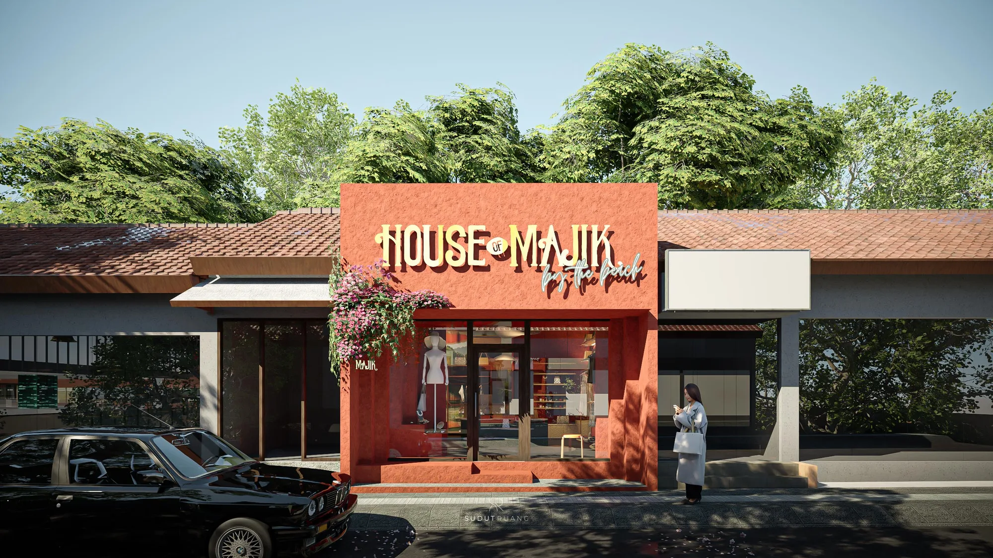 House of Majik's terracotta storefront with its signage and flowering vine above the glazed entrance, tiled roof extending along the strip.