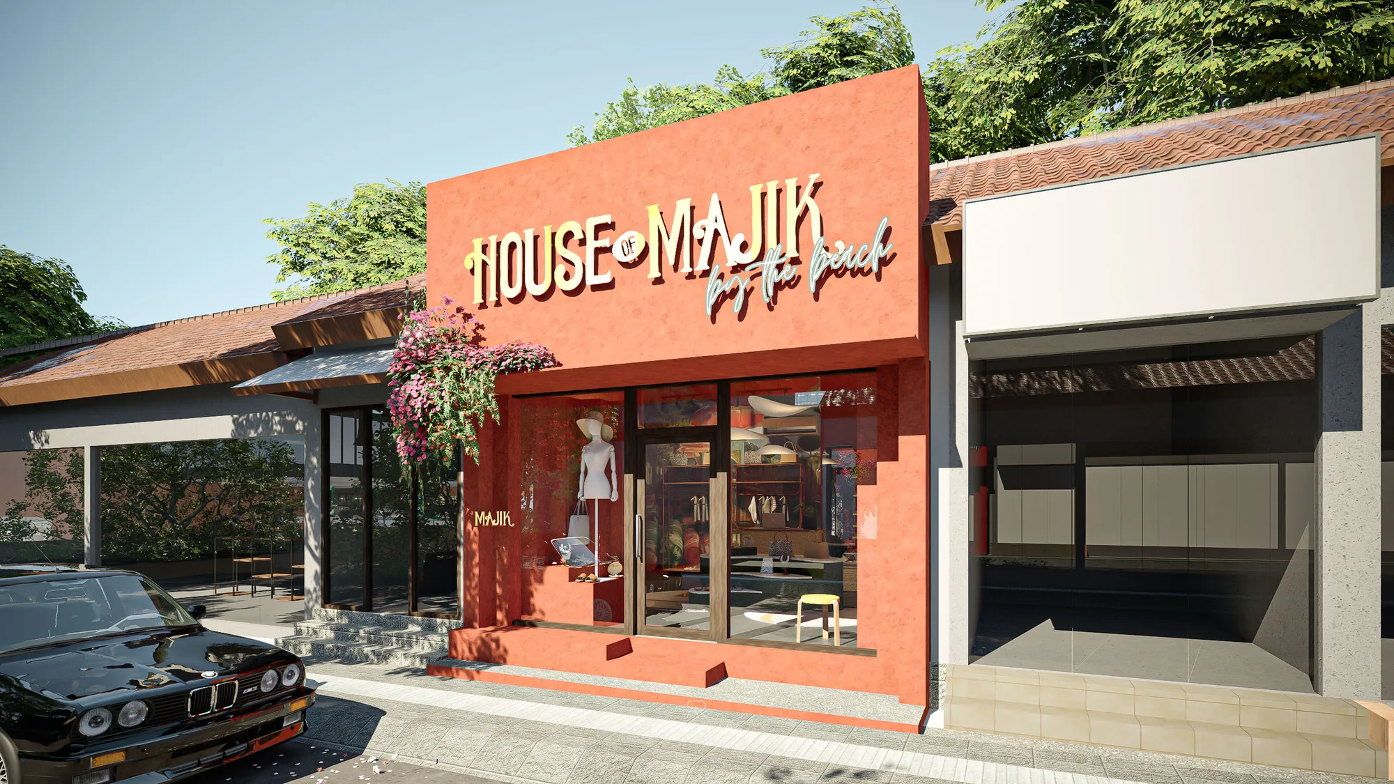A close angle on House of Majik's terracotta corner, its signage lit above a cascade of pink flowering vine over the glazed storefront.