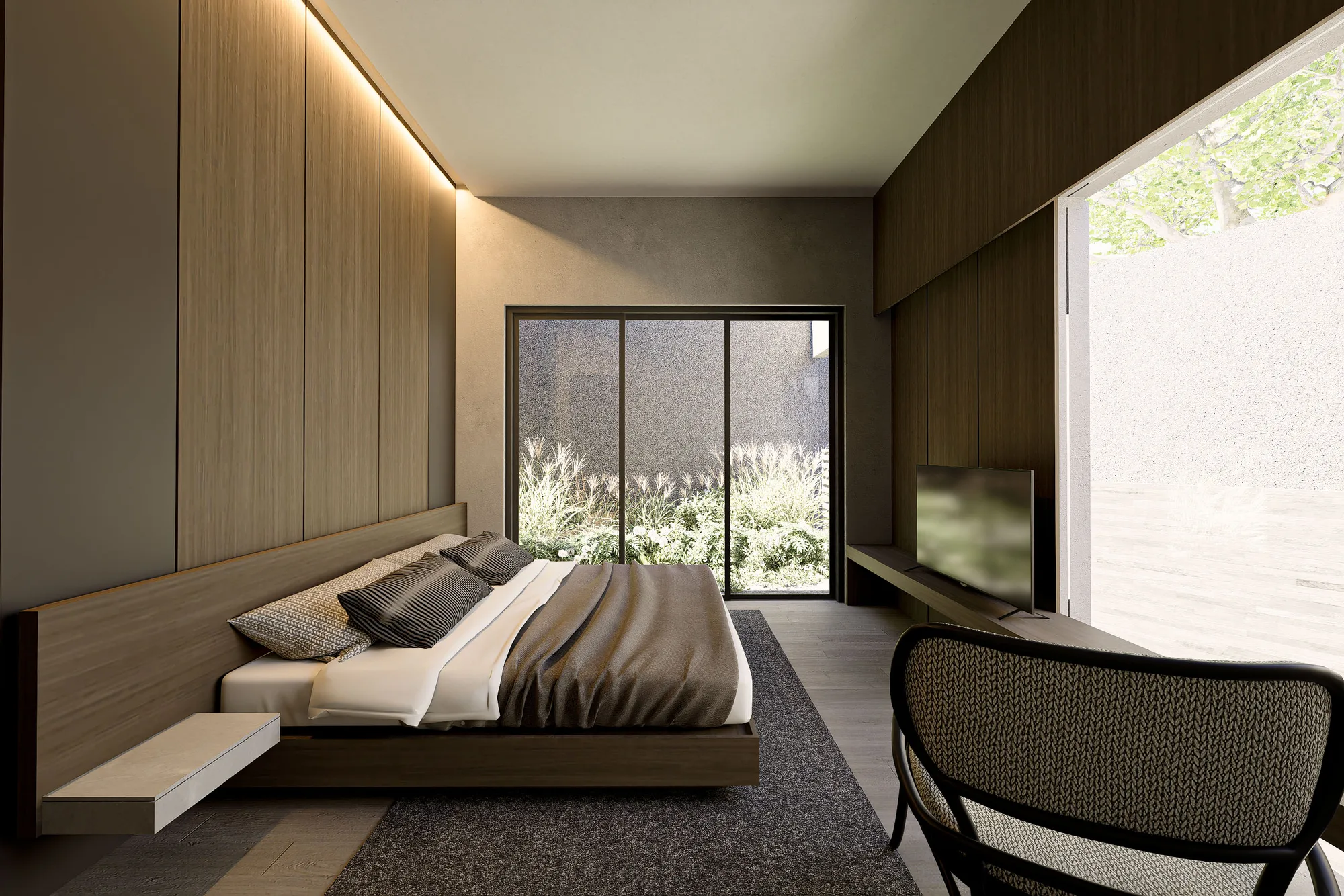 Primary bedroom with a floating timber headboard, layered bedding, and sliding doors framing an ornamental grass planting.