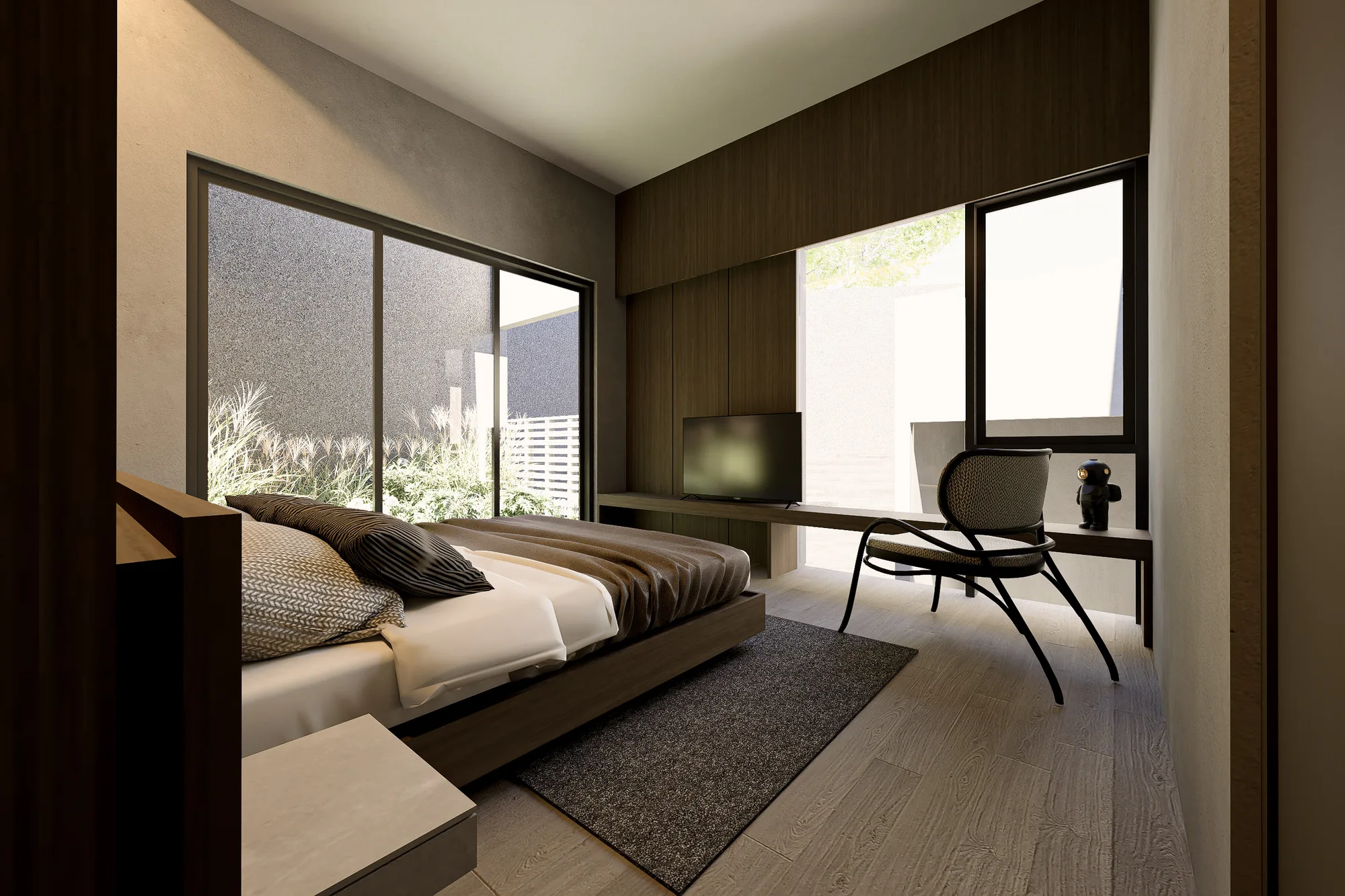 Bedroom seating corner with a woven armchair beside a low media console and a courtyard-facing window.