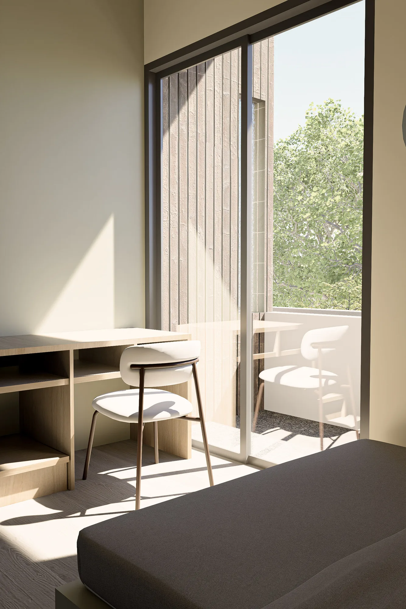 Bedroom desk beside a sliding glass door onto a private balcony, its wood-slat screen reflected in the glass.