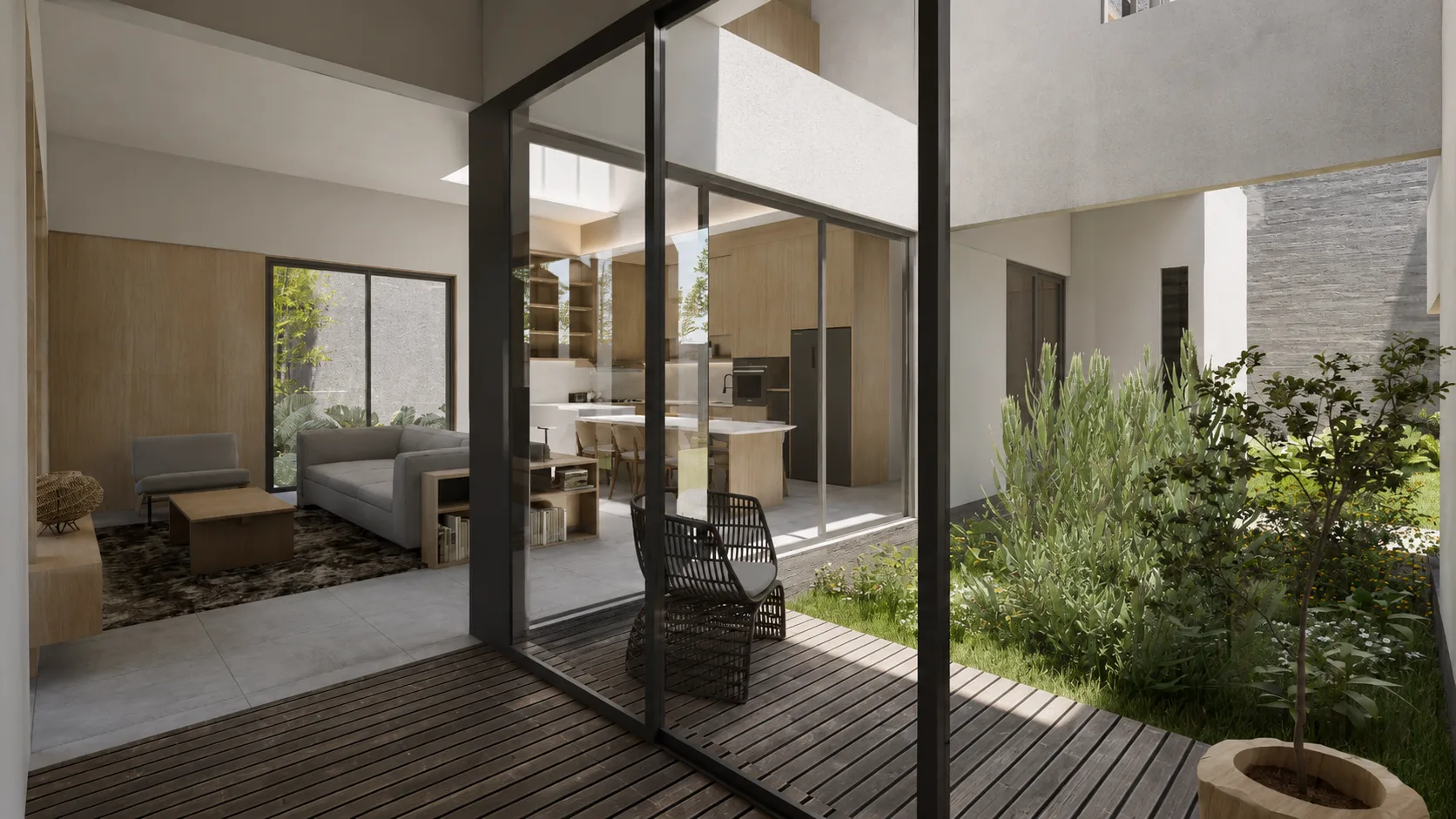 Living and dining area opening through a pivoting glass door onto a planted courtyard with a rattan chair.