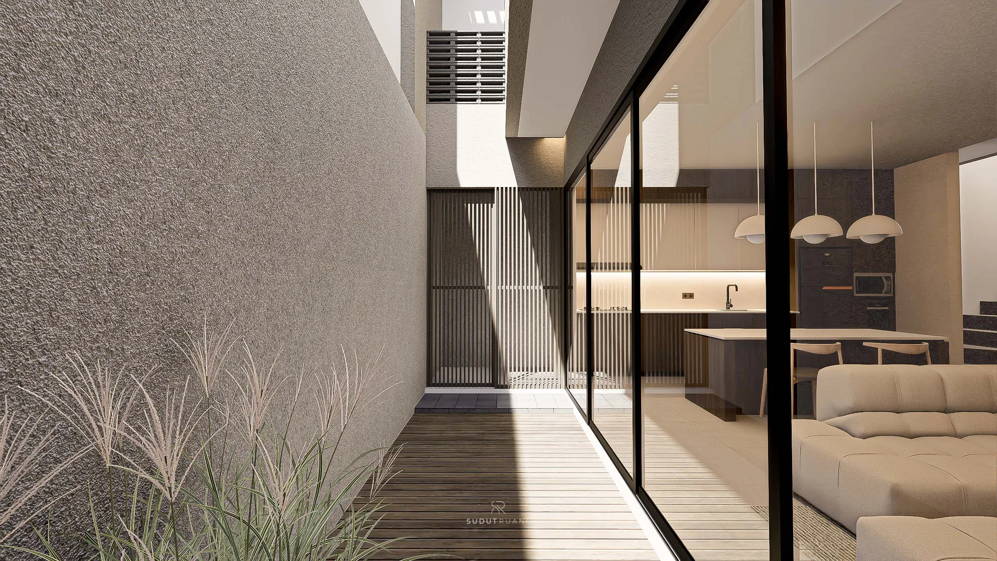 KF House's narrow side garden, planted with ornamental grasses along a timber-decked corridor, seen through full-height glass from the open living-dining-kitchen.