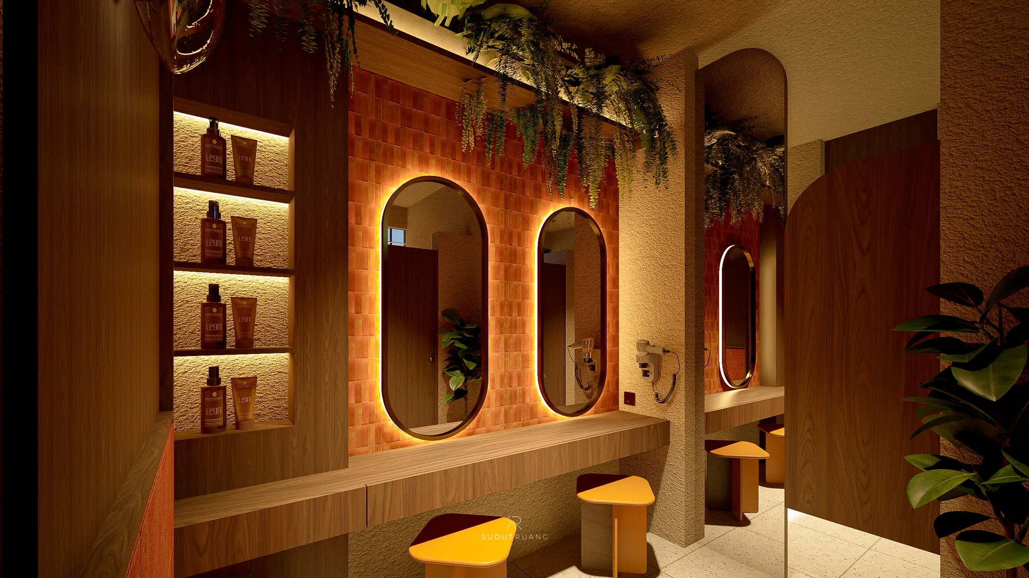 A grooming nook with backlit oval mirrors set into a terracotta-tiled wall, amenities shelved beside hanging plants.