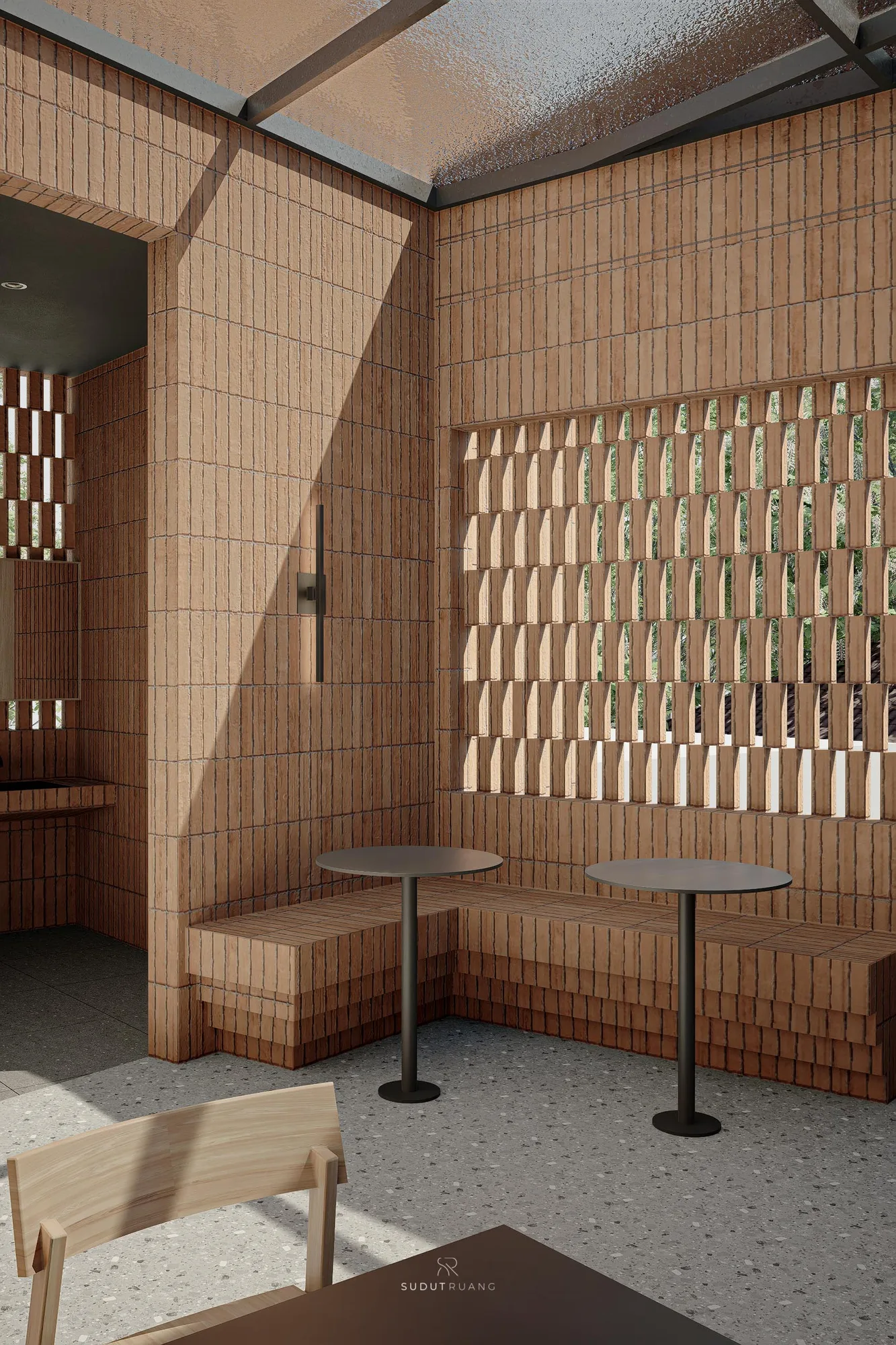 Corner detail of the perforated brick screen against the tiled interior wall, daylight passing through the gaps between bricks.