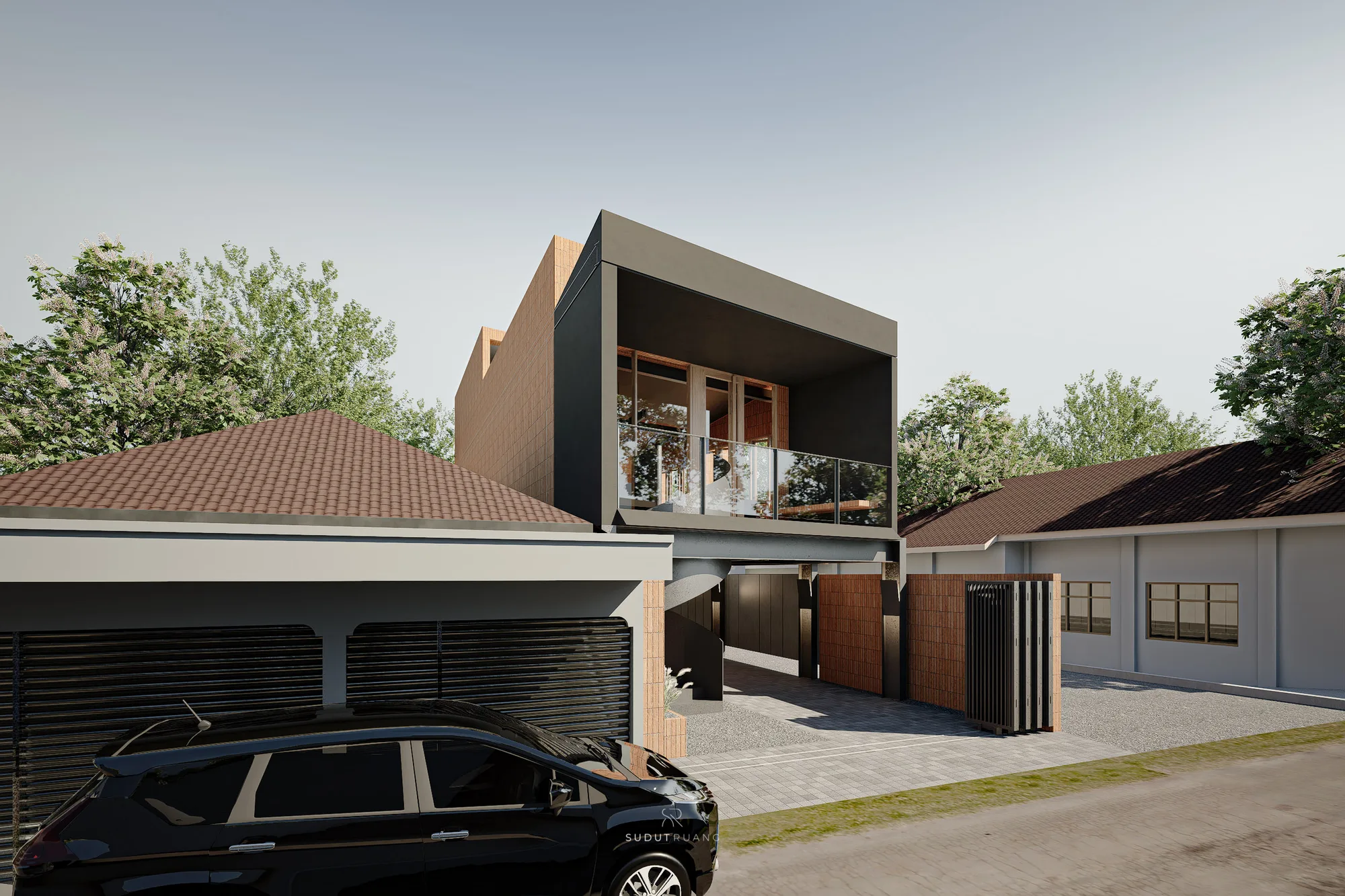 Angled view of the tilted brick-clad volume cantilevering over the entrance, its spiral stair and stone infill wall visible underneath.