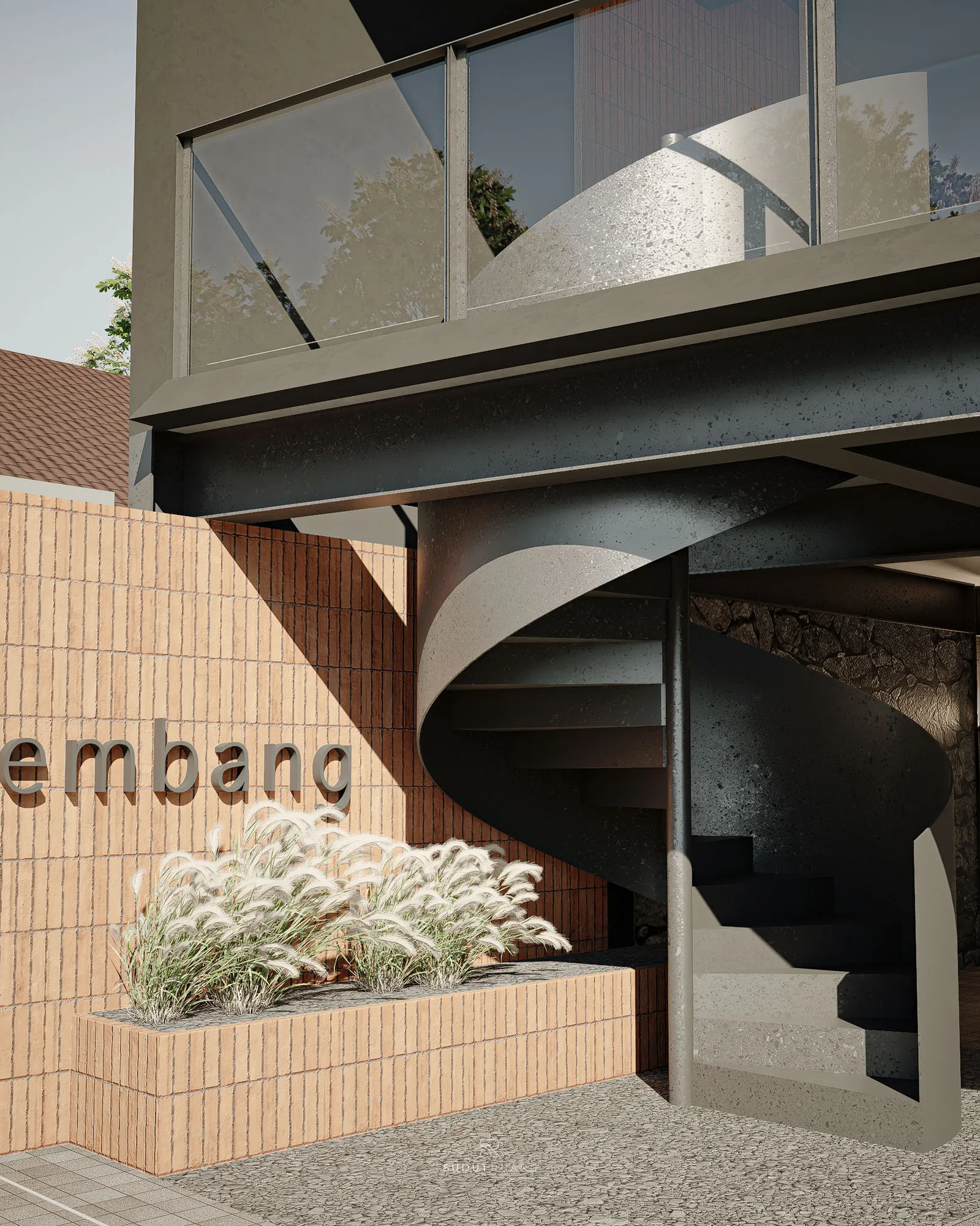 "lembang" lettering set into the brick entrance wall beside ornamental grasses, the concrete spiral stair curving up behind it.