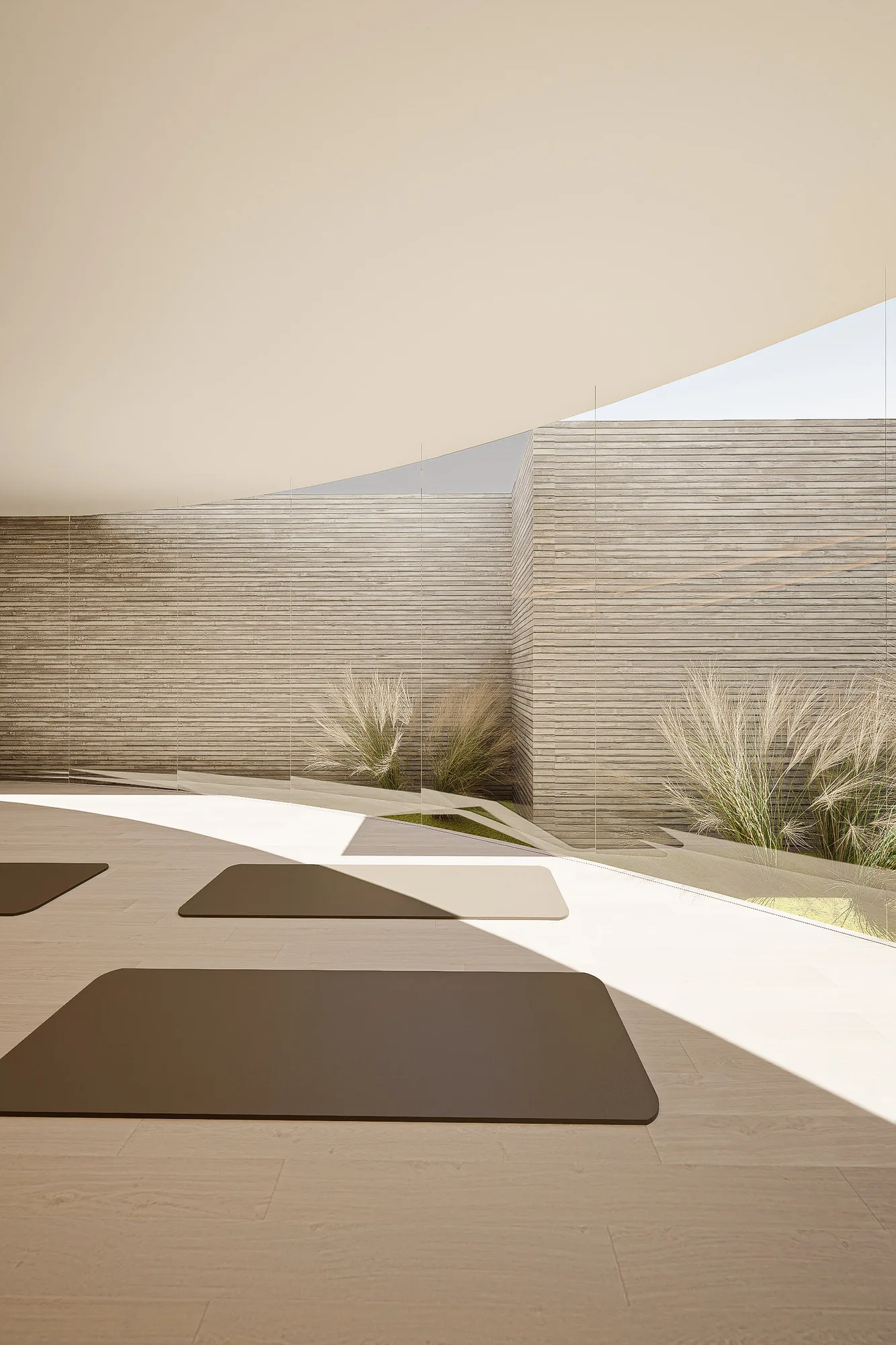 Courtyard corridor with terracotta tile floor curving past a slender white column toward a mirrored door.