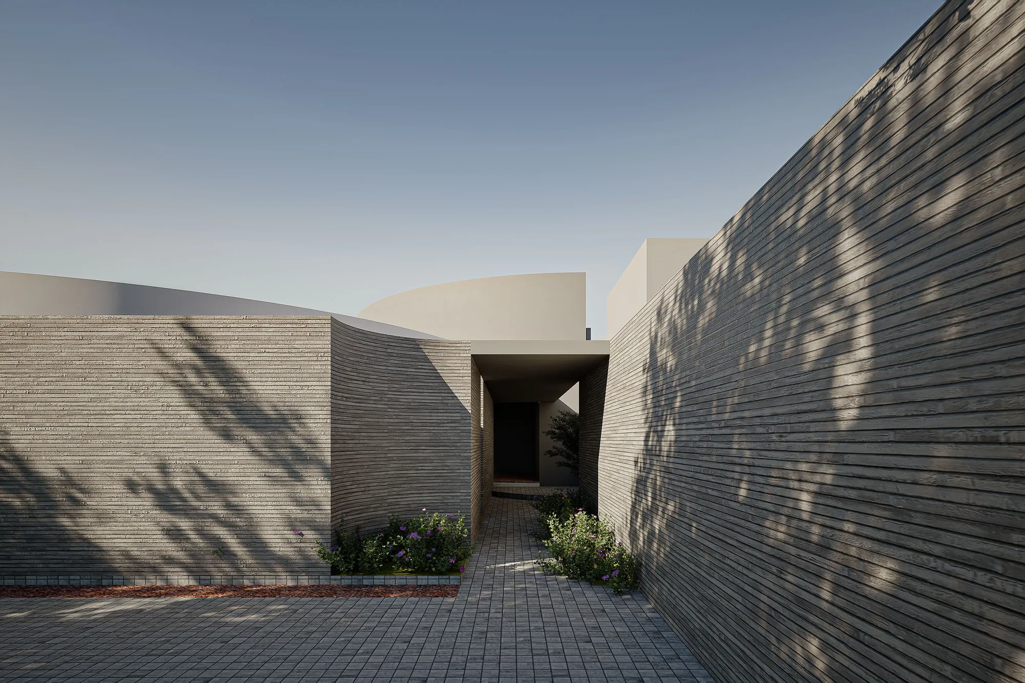 Narrow entry alley between ribbed board-formed walls leading into Pilates and Daycare's courtyard.