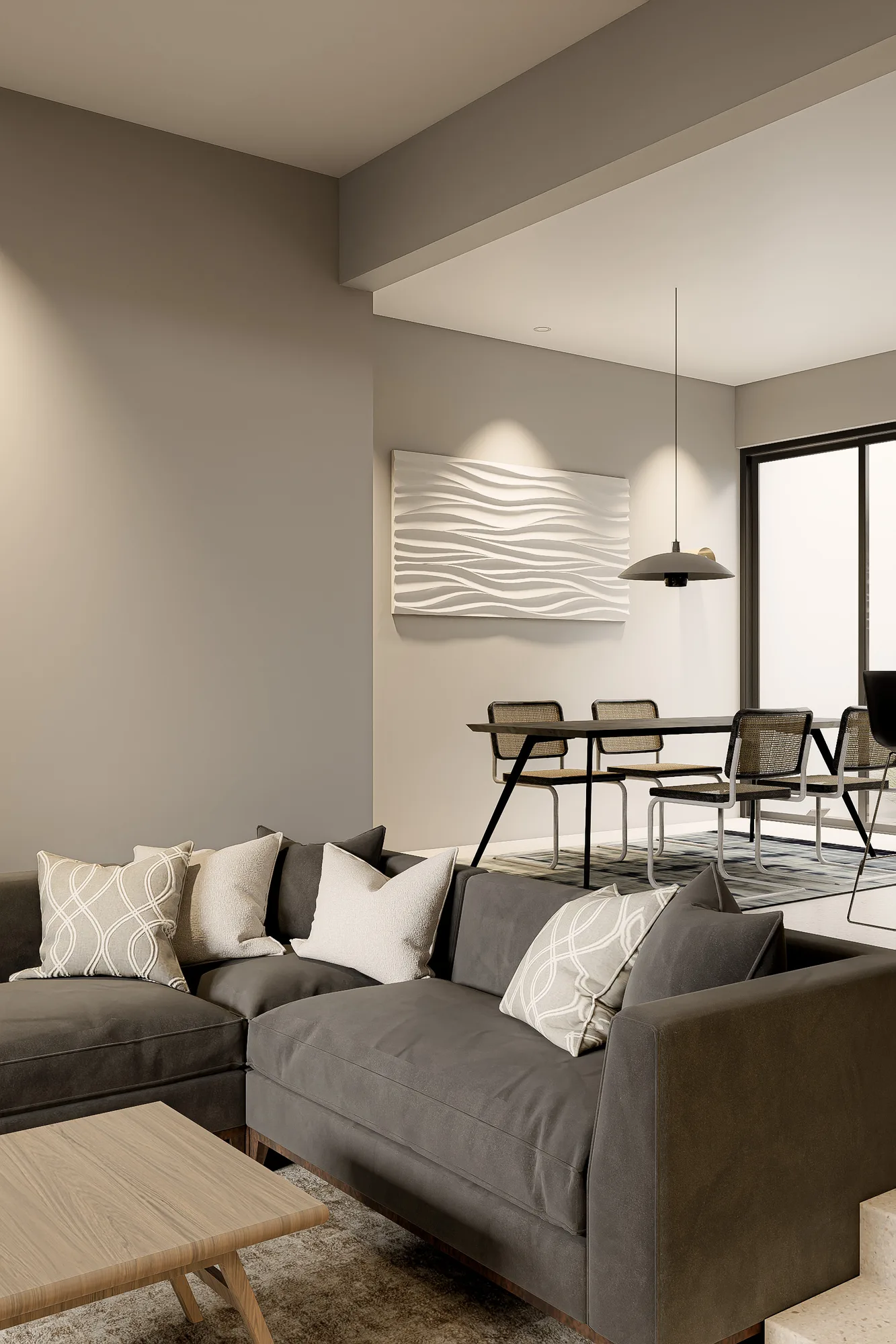 Dining area with a caned-back chair set beneath a wave-textured wall panel and a pendant lamp.