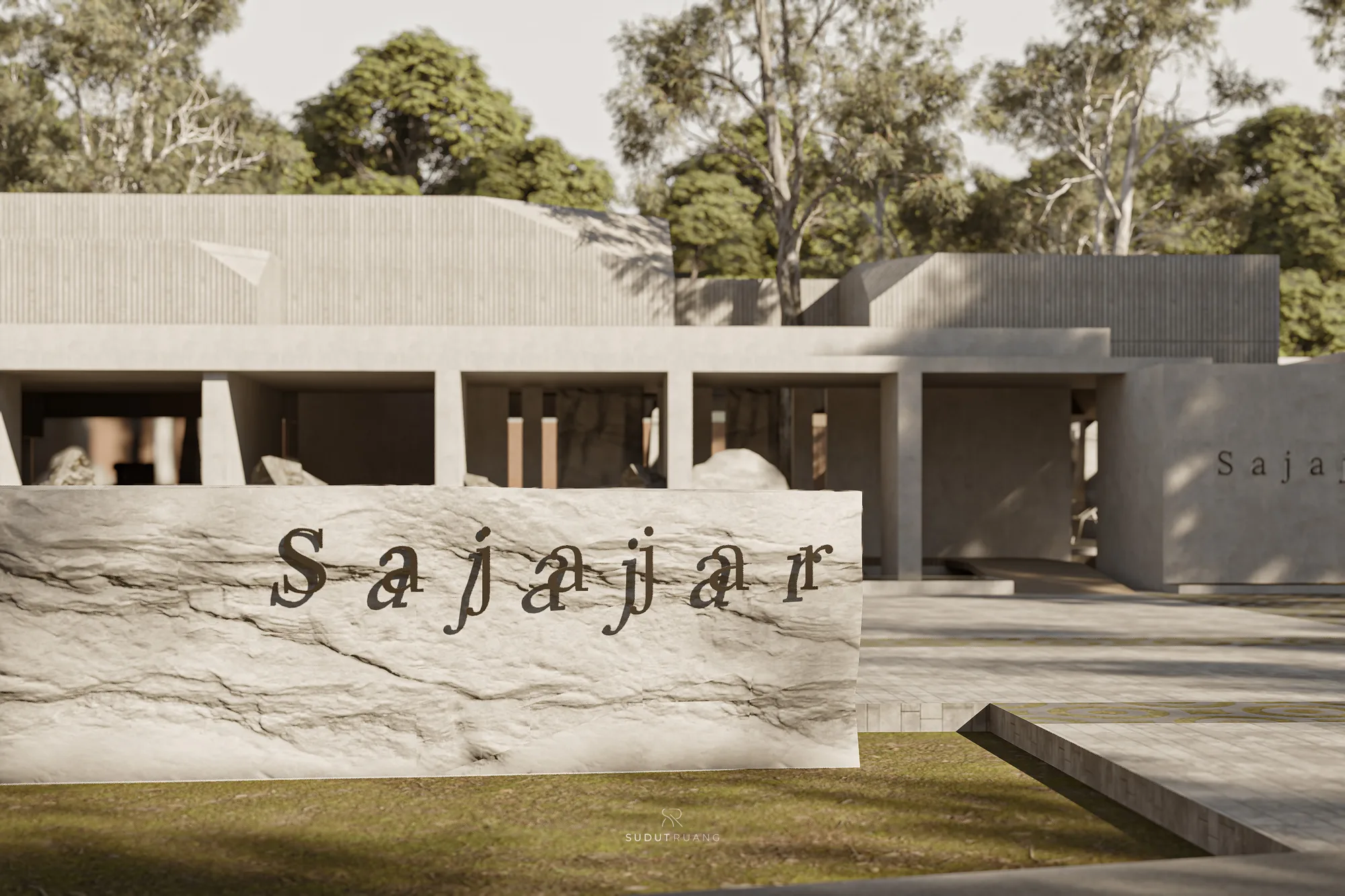 A carved stone sign reading "Sajajar" set into a screened wall, trees rising behind it.