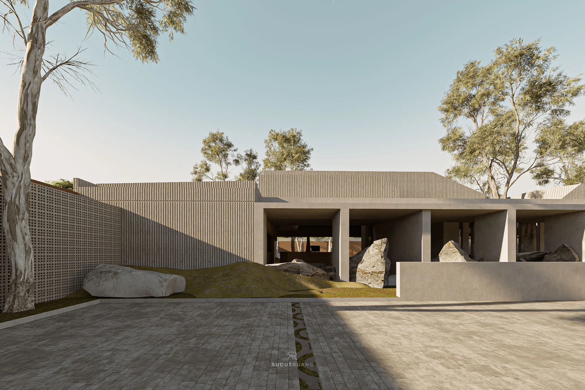 Sajajar Space's front elevation, concrete overhangs and a perforated screen wall set among boulders and trees.