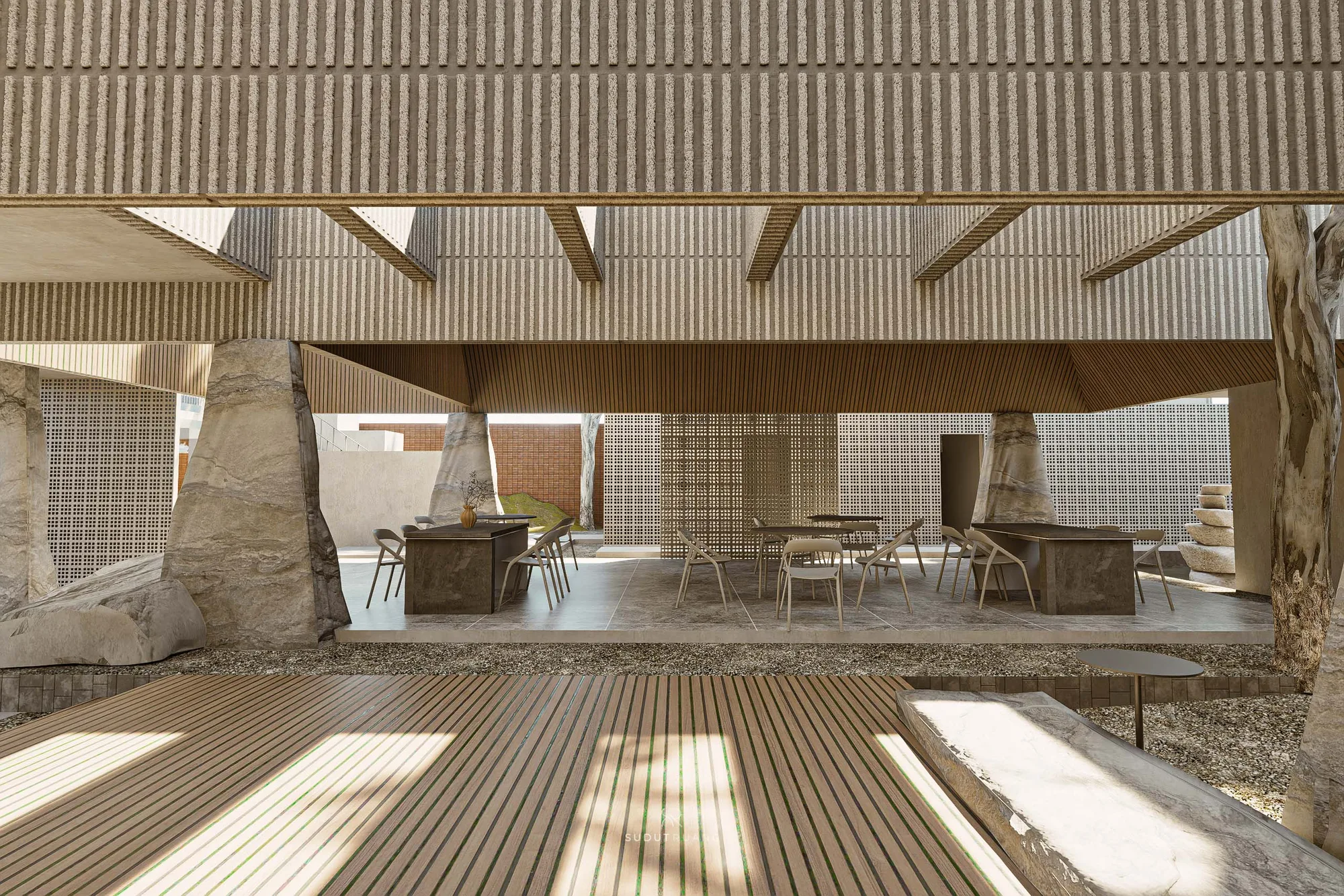 The terrace's gravel garden and brick boundary wall, a tree rising through the paving beside planted screen boxes.
