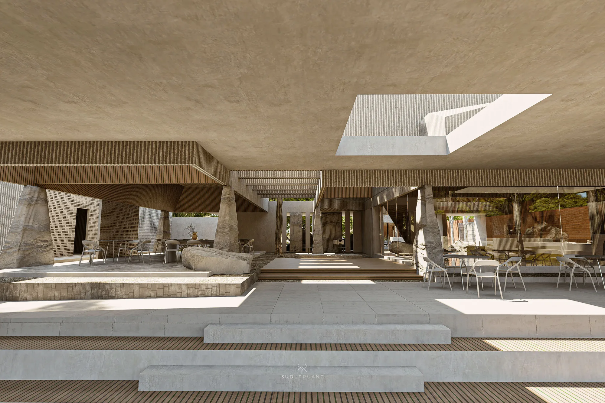 Grey upholstered chairs at round tables on the terrace, a boulder marking the edge of the seating.