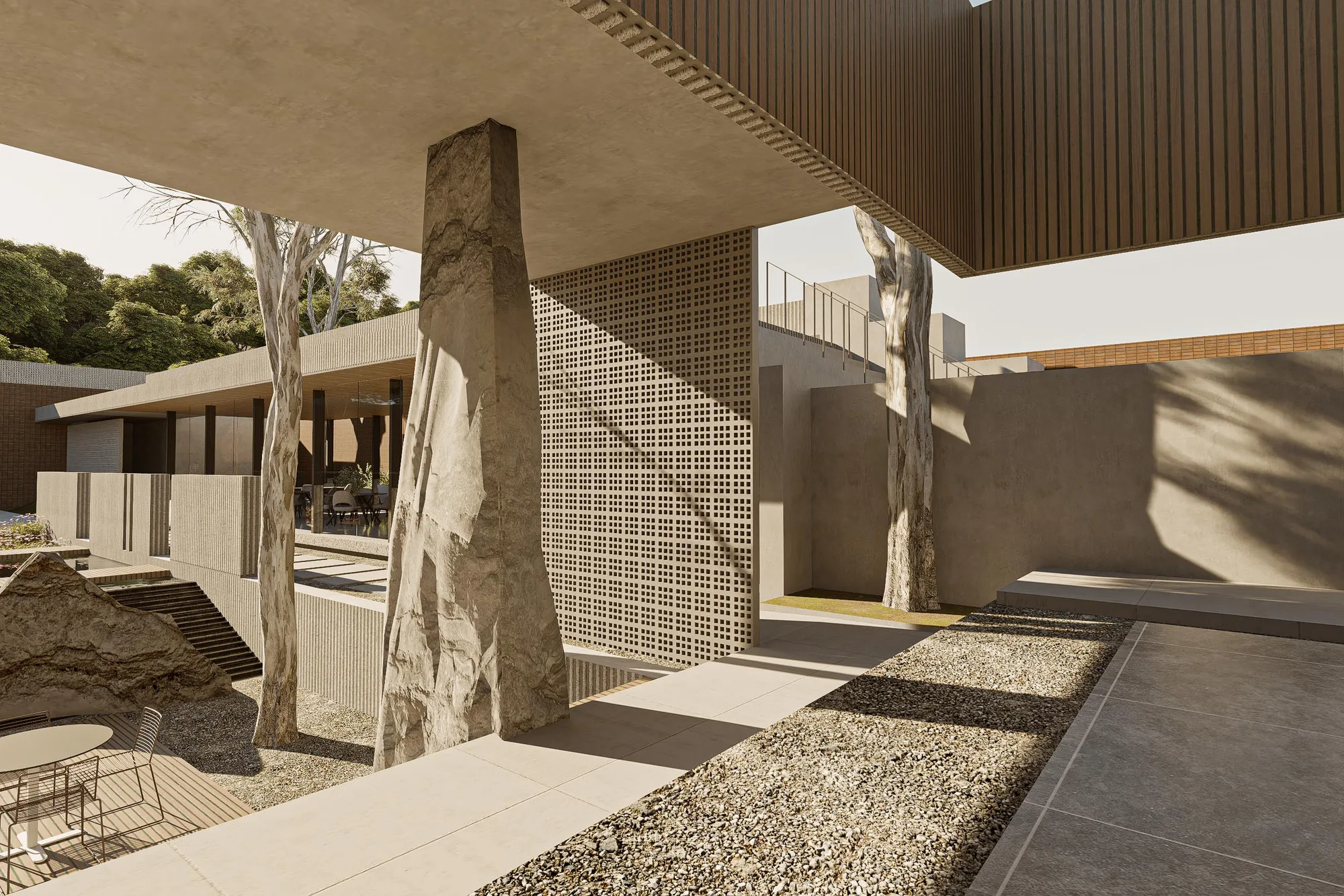 The covered walkway's dining tables, its glass wall reflecting the courtyard and brick boundary beyond.