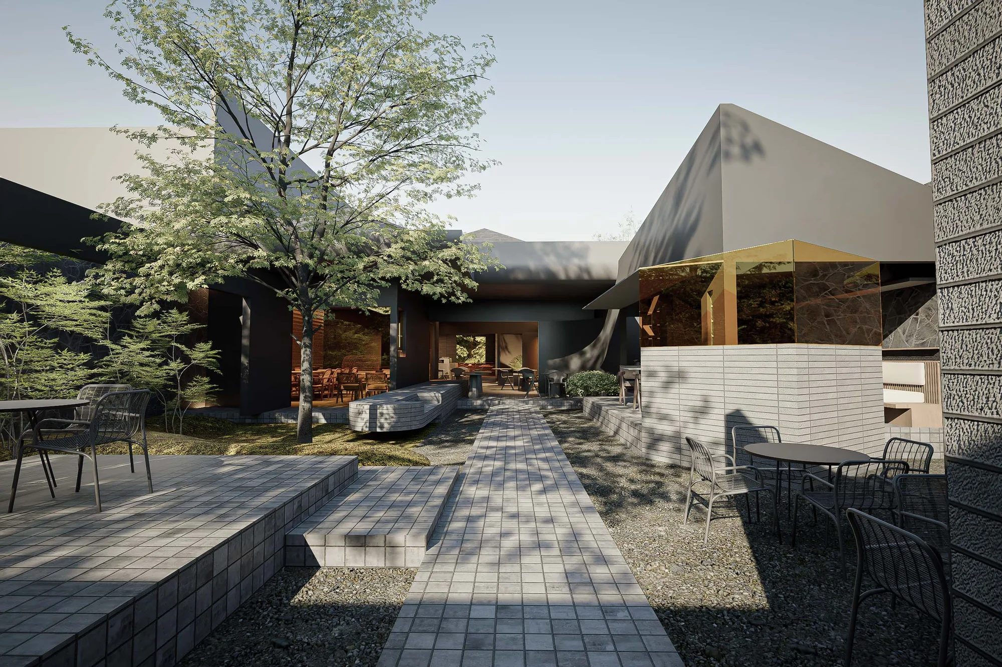 Courtyard path between the black-clad dining wing and a gold-mirrored volume, the existing tree kept standing where it was.