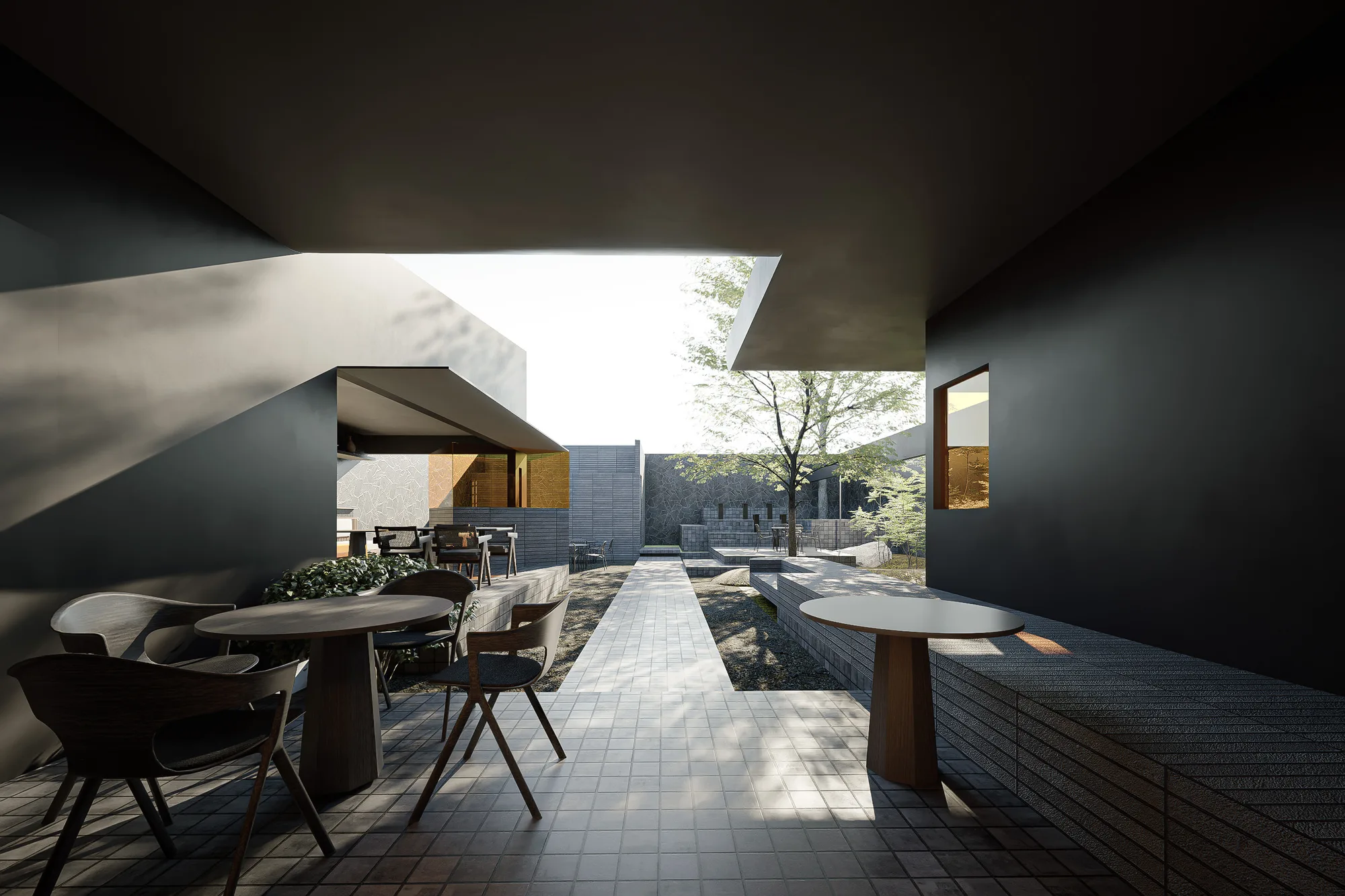 Outdoor dining chairs under the black facade, its slatted window glowing warm against the stone wall behind.