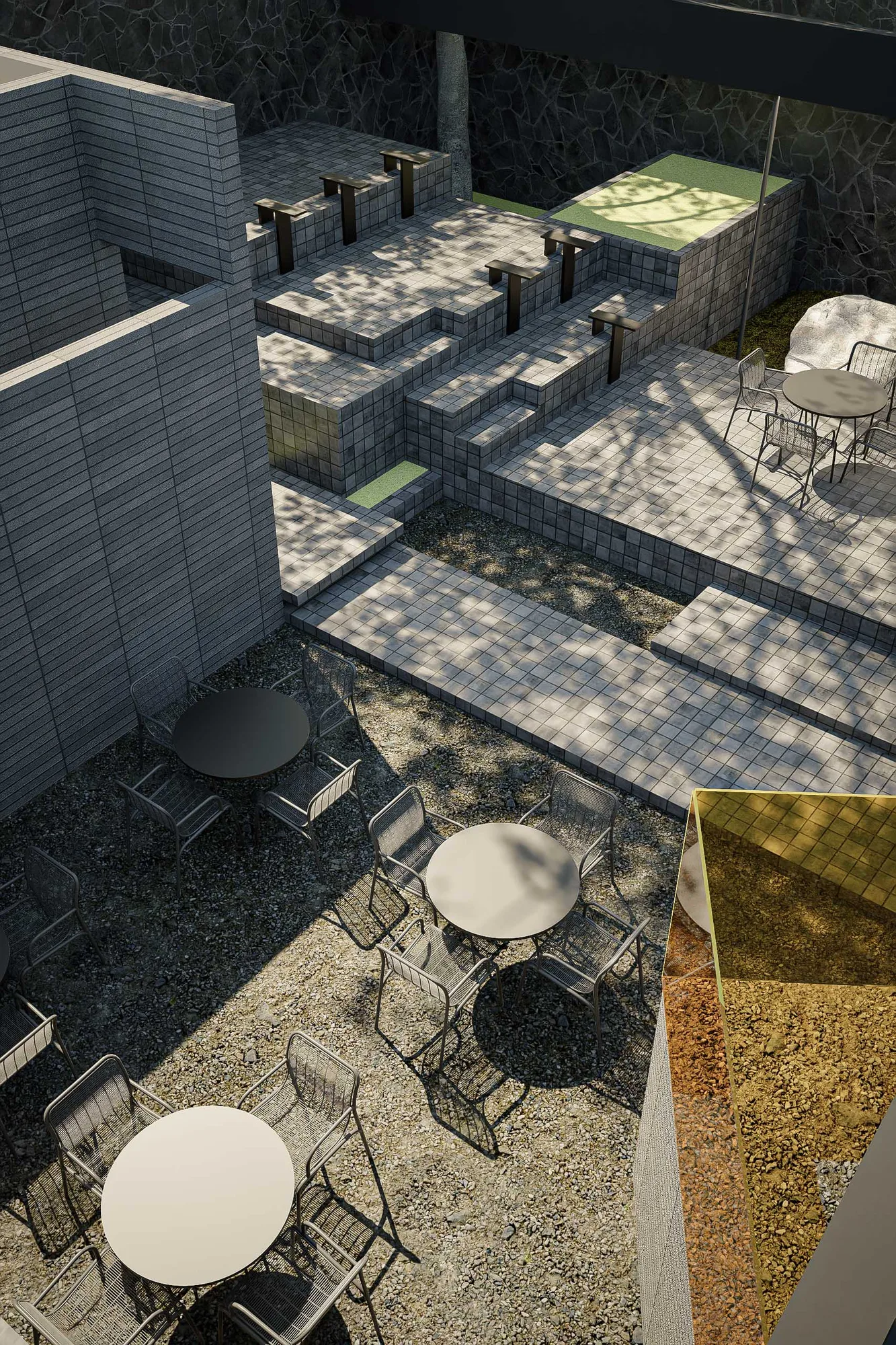 Garden chairs beside a boulder against the stone boundary wall, young trees screening the corner.