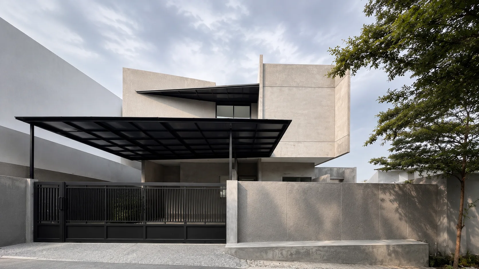 Street elevation of TR-house, a perforated screen facade shaded by an existing tree.
