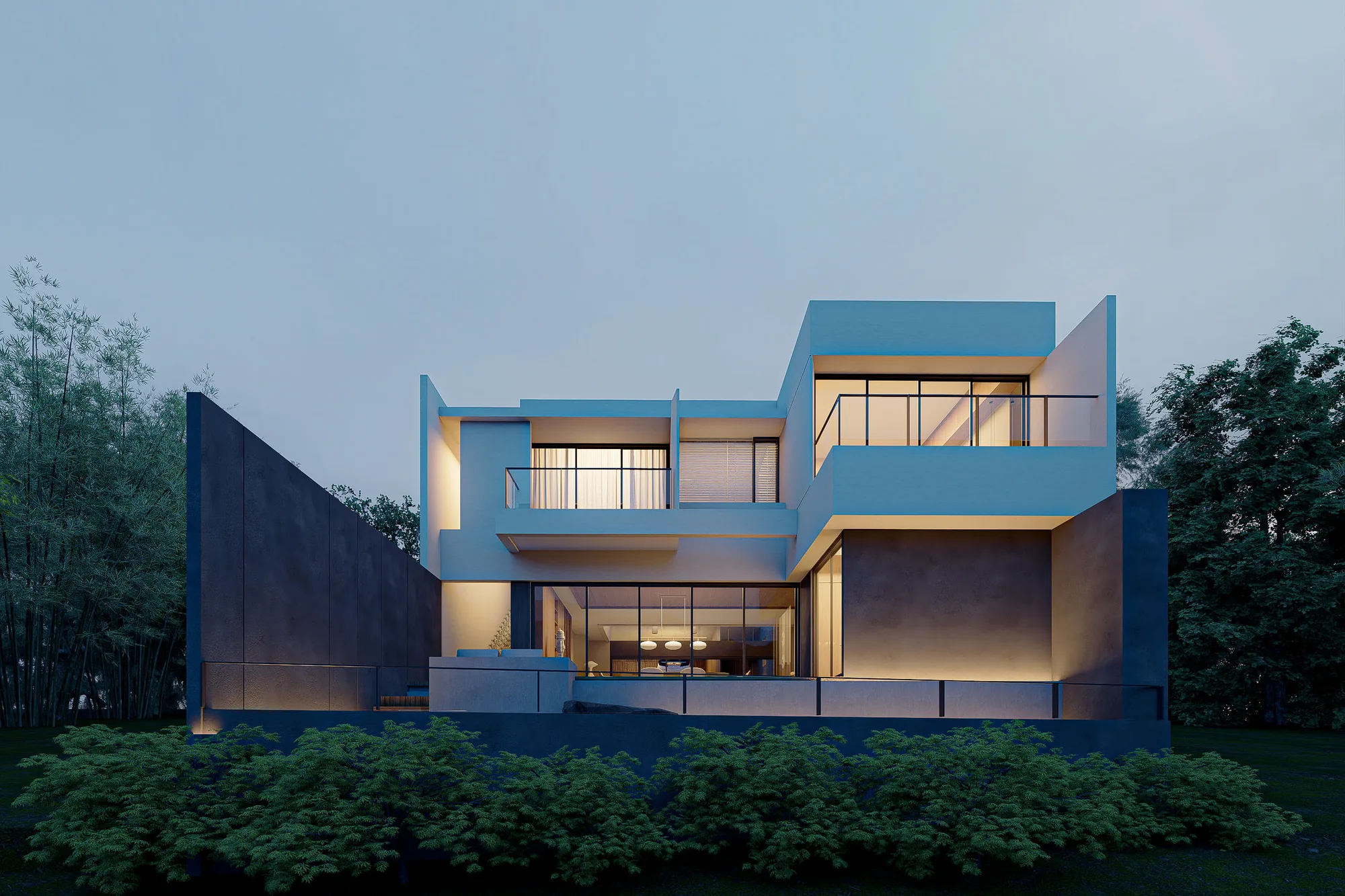 Taut house at dusk, its cantilevered upper floor and terrace glowing against a dark stone base and surrounding bamboo grove.