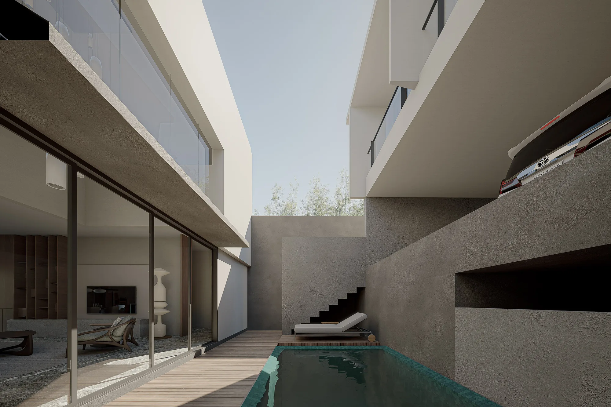 Pool deck at the rear of the house, a lounger set beneath an open stair leading up between concrete walls.