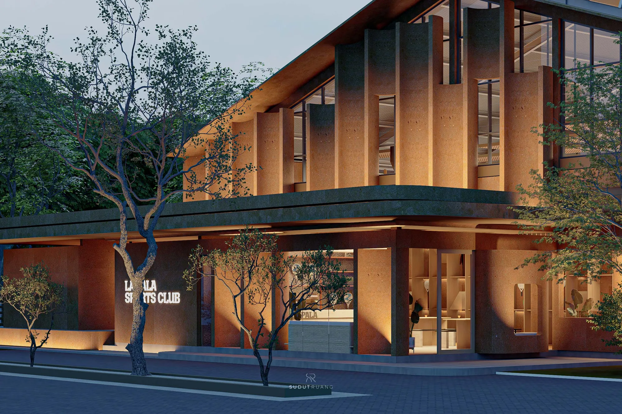 A closer dusk view of Terra Sports Club's undulating column screen and terracotta base, with mature trees kept close against the facade.