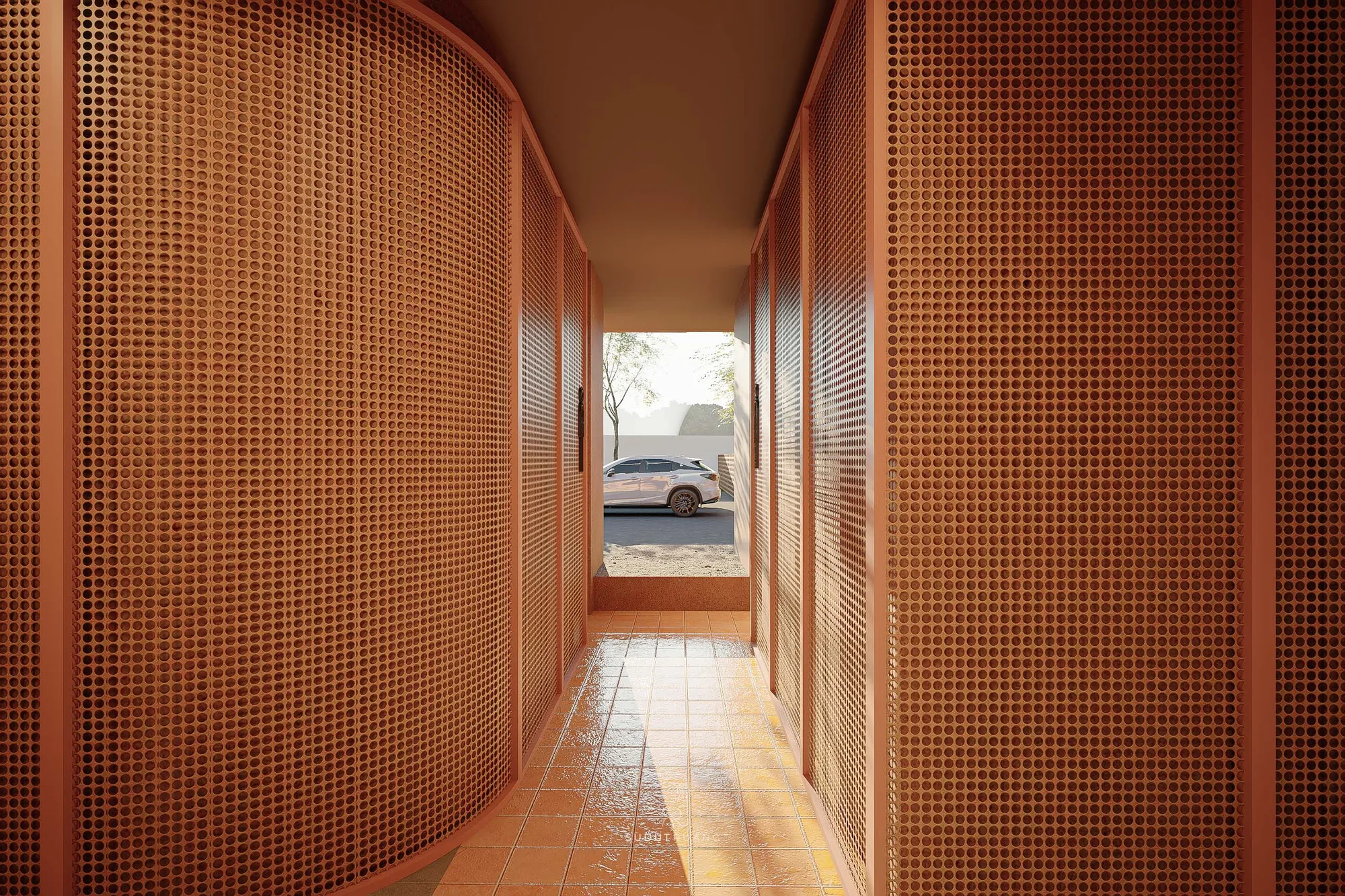 The curved perforated-metal entry tunnel at Terra Sports Club frames a glimpse of the parking court and a tree beyond its far end.