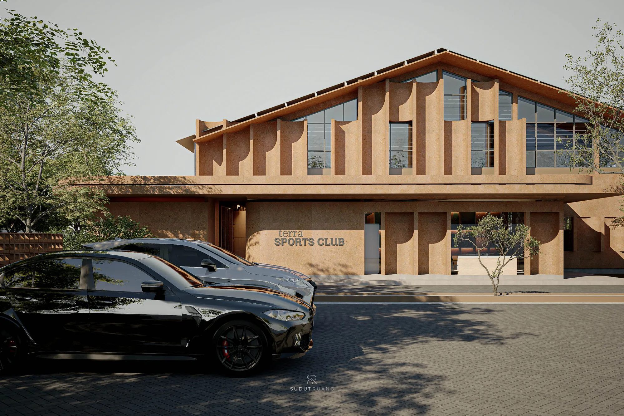 A closer daytime view of Terra Sports Club's entry facade, with cars parked before the terracotta wall bearing the club's cast signage.